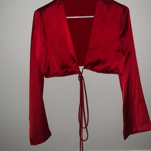 A red wrap around crop top. - Picture 1 of 1